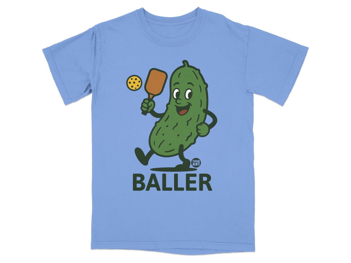 Cartoon pickle playing pickleball with "BALLER" text below.