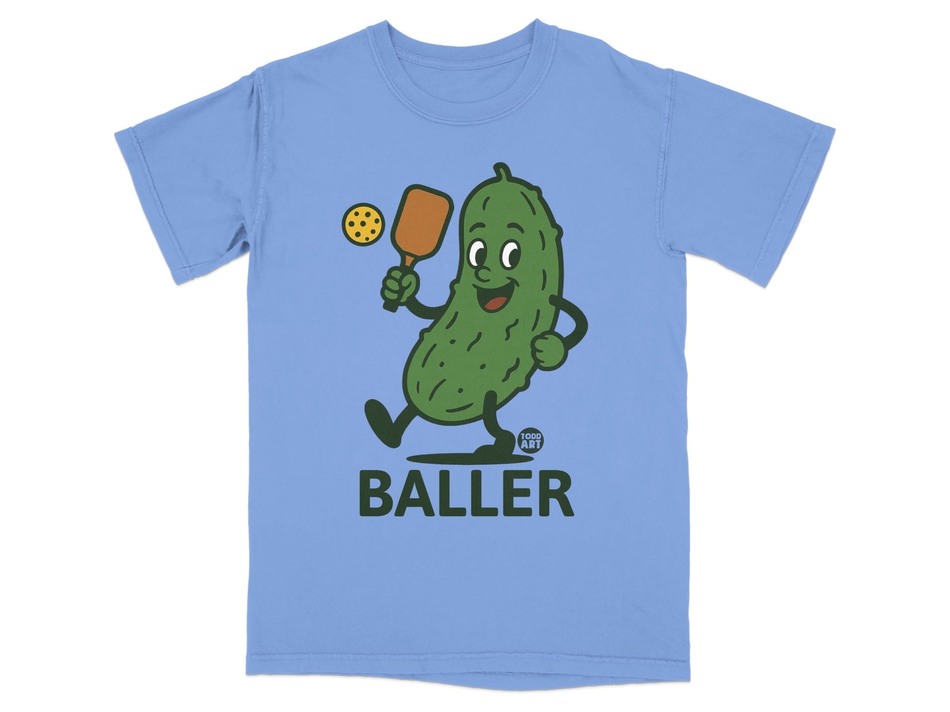 Cartoon pickle playing pickleball with "BALLER" text below.