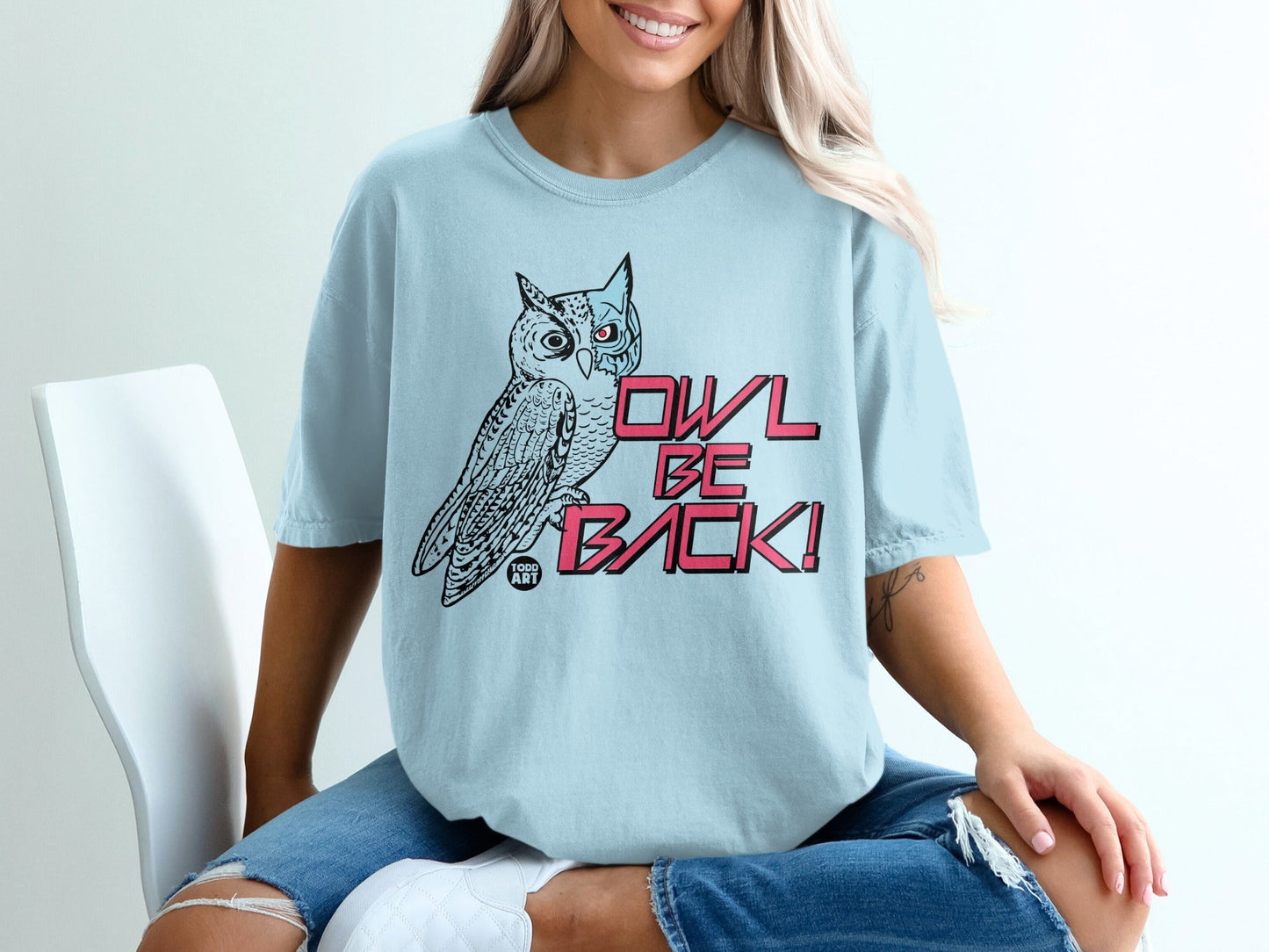 Light blue t-shirt with an owl graphic and "OWL BE BACK!" text.