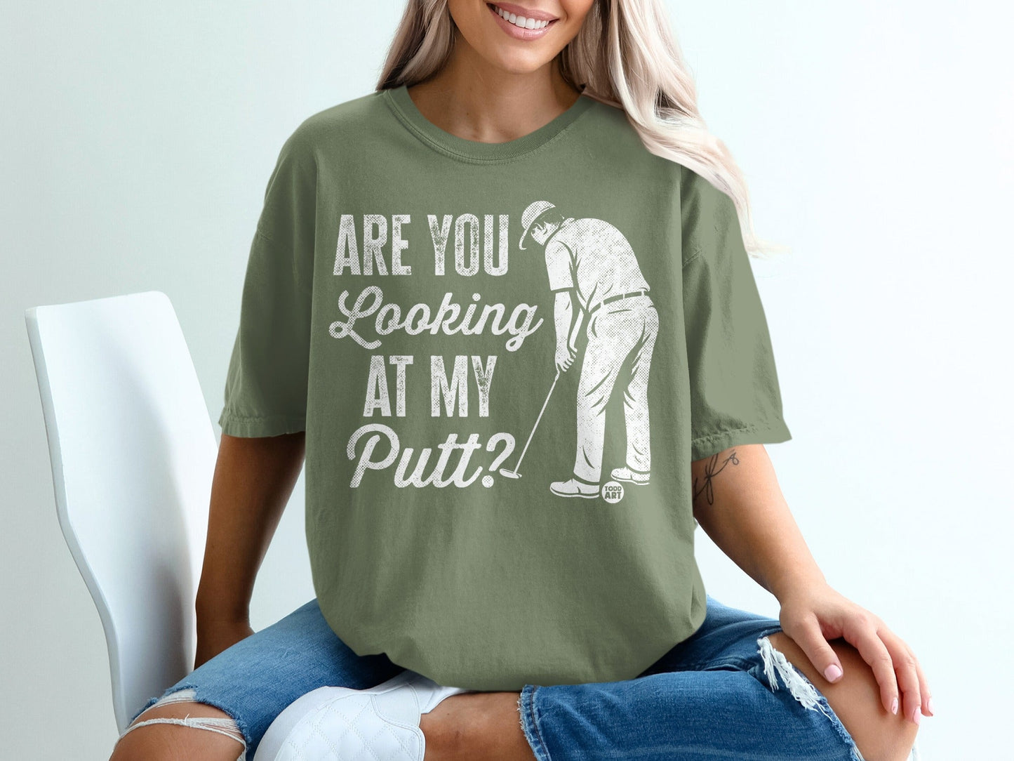 Green t-shirt with "Are You Looking at My Putt?" text and golf graphic.