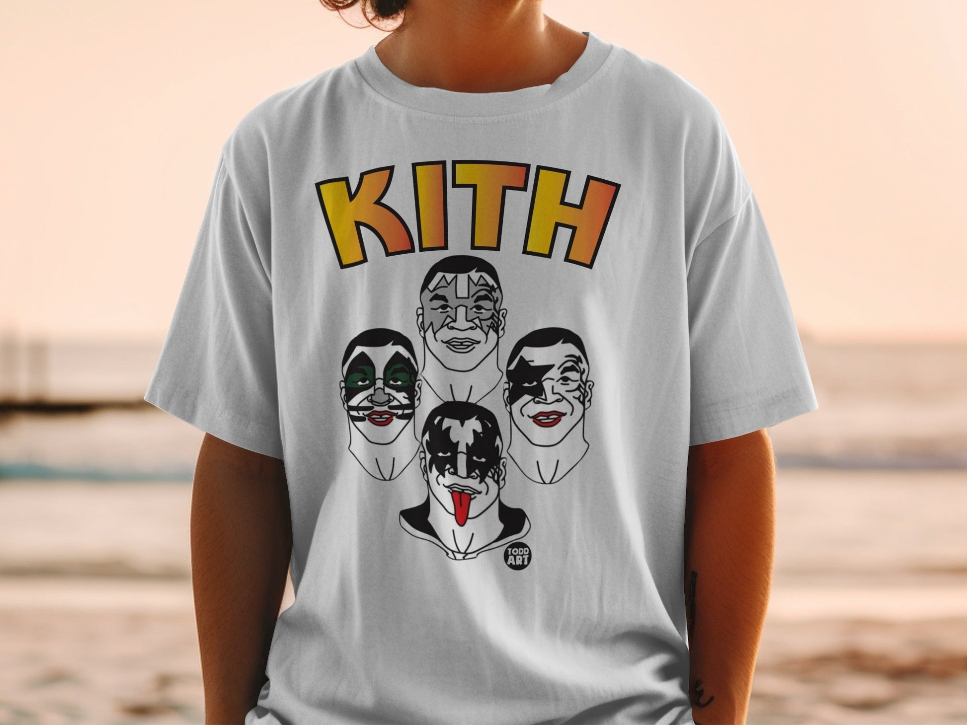 White t-shirt featuring Kith logo and four KISS band members' face paint designs.