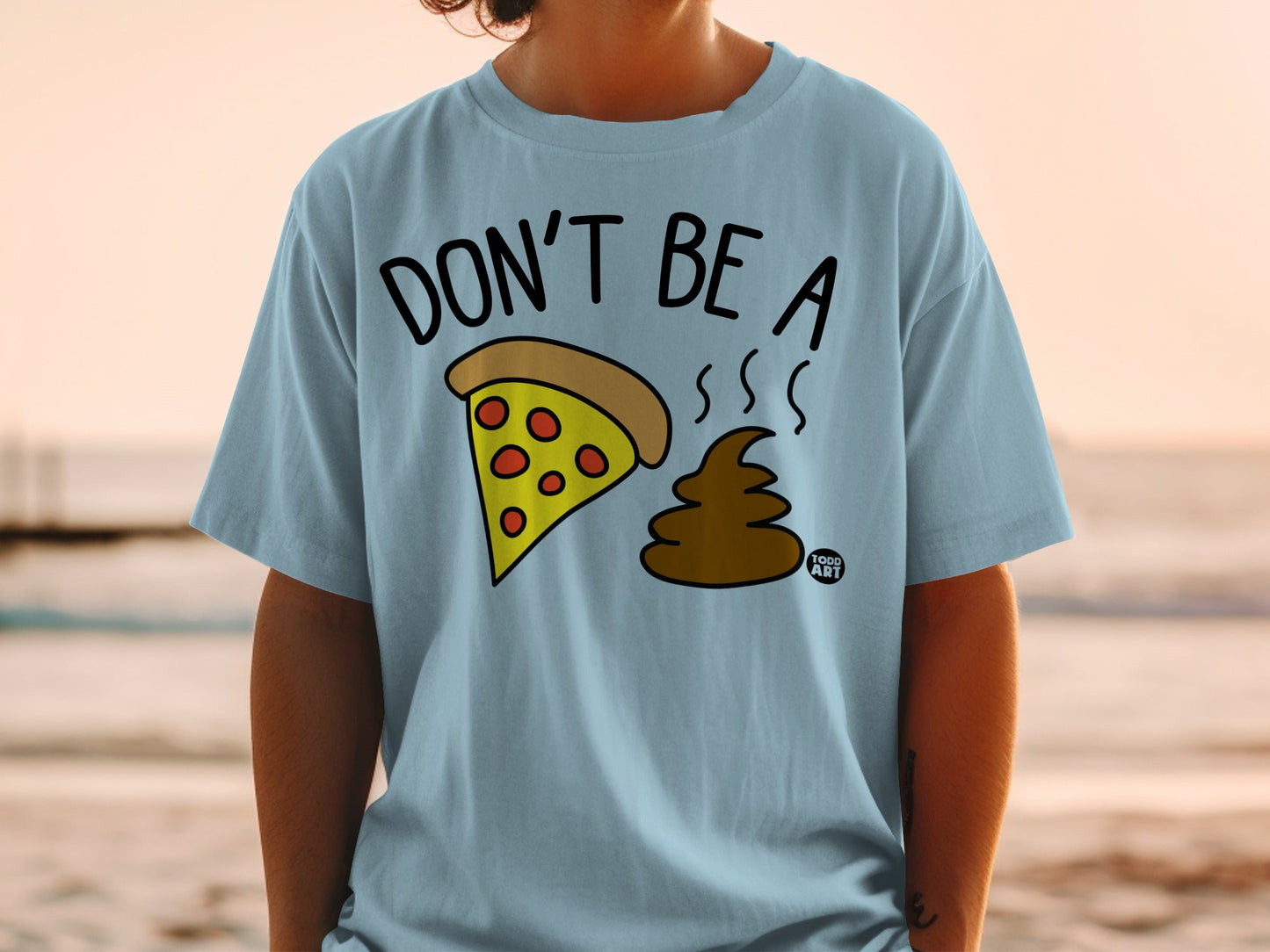 Light blue t-shirt with "DON'T BE A" and pizza slice and poop emojis.