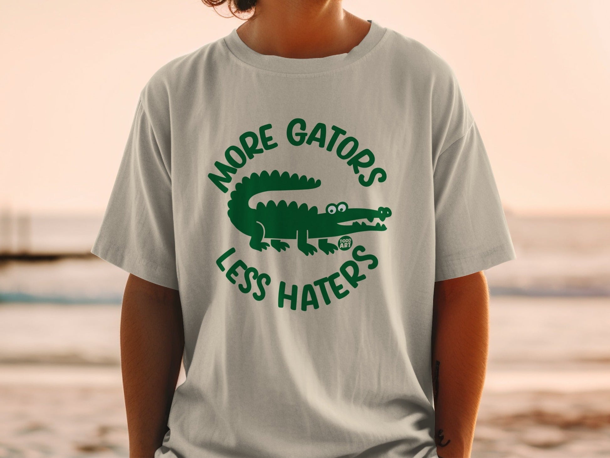 T-shirt with "More Gators Less Haters" text and alligator graphic.