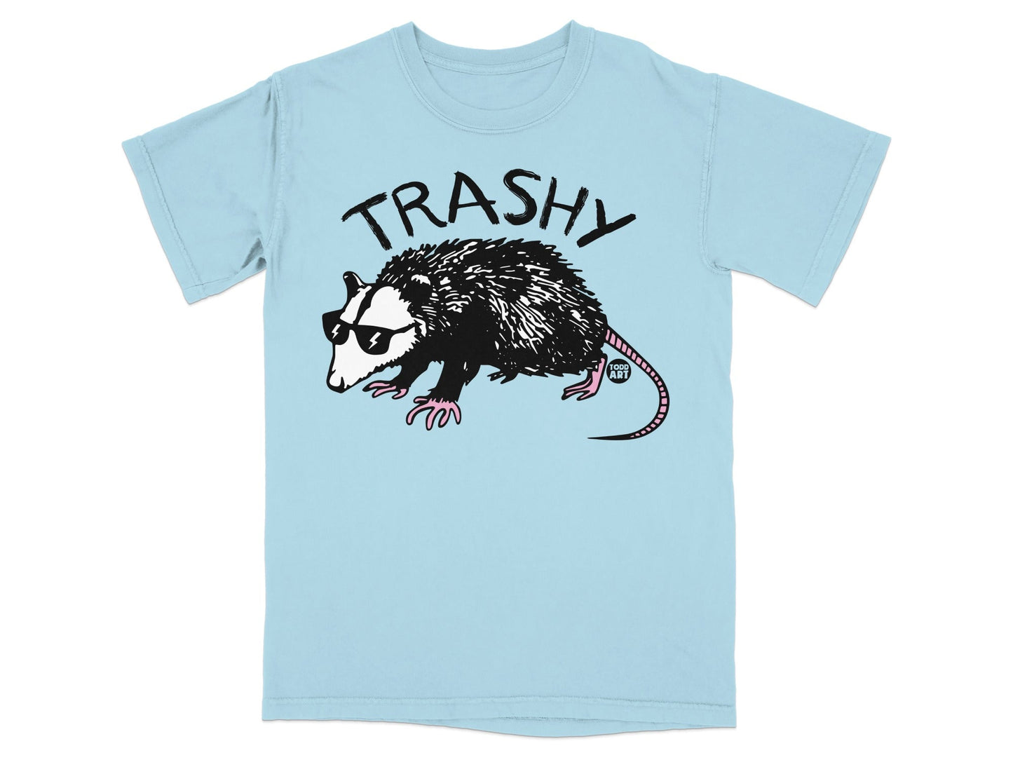 Light blue t-shirt with a "TRASHY" possum wearing sunglasses and pink gloves.