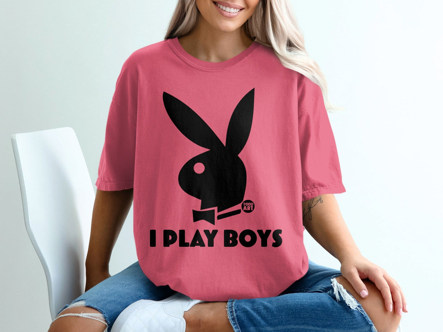 Pink t-shirt with black Play-Boy bunny logo and text "I PLAY BOYS".