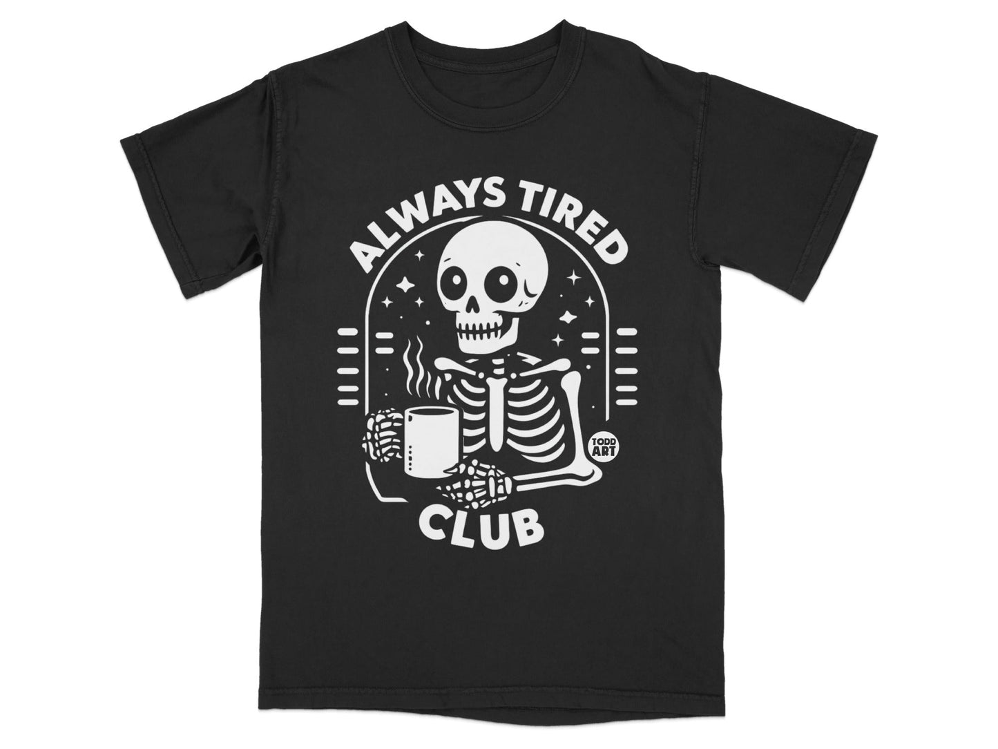 Black t-shirt with a skeleton holding a coffee mug, "Always Tired Club" text.