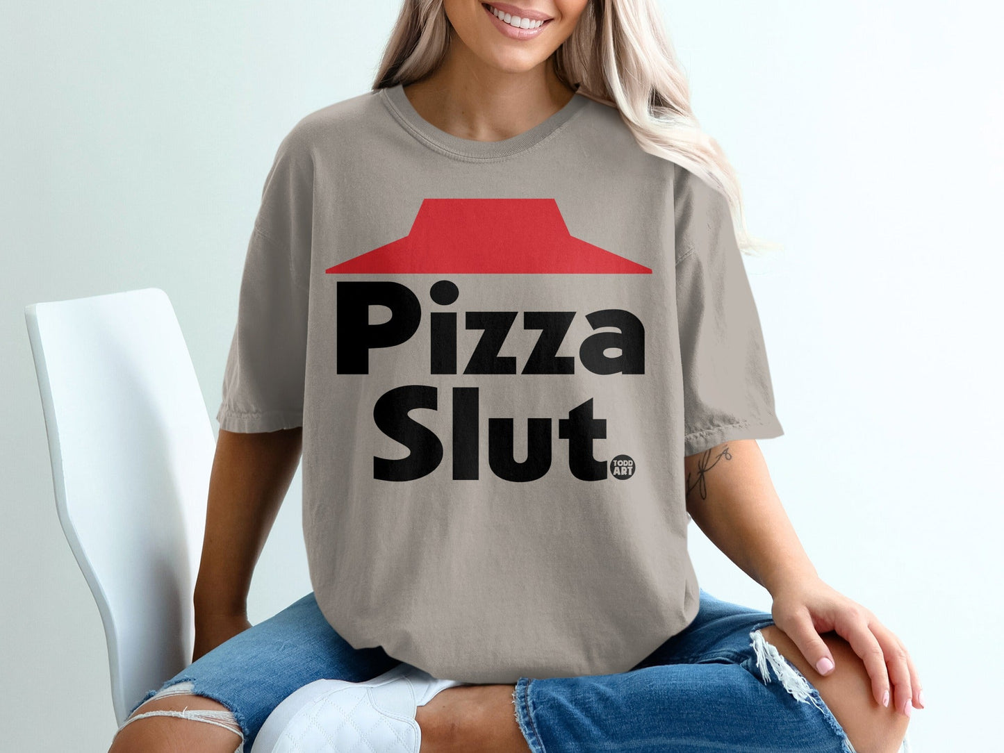 Comfort Colors t-shirt with "Pizza Slut" graphic on a woman.