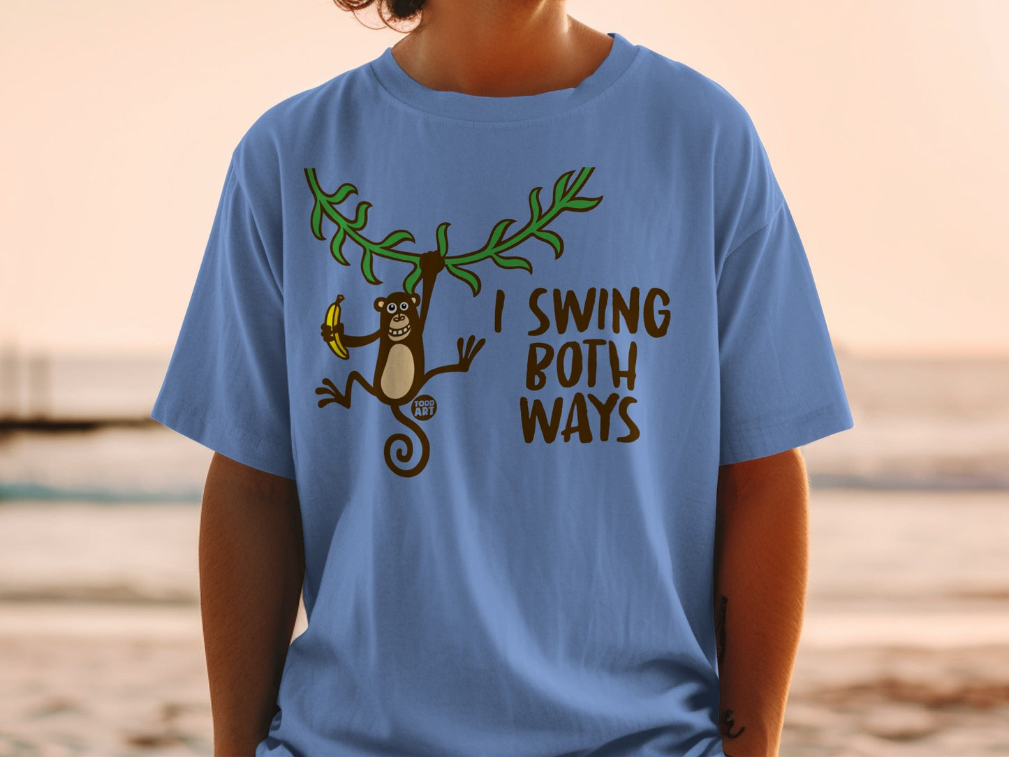 Blue t-shirt with monkey swinging and text "I SWING BOTH WAYS".