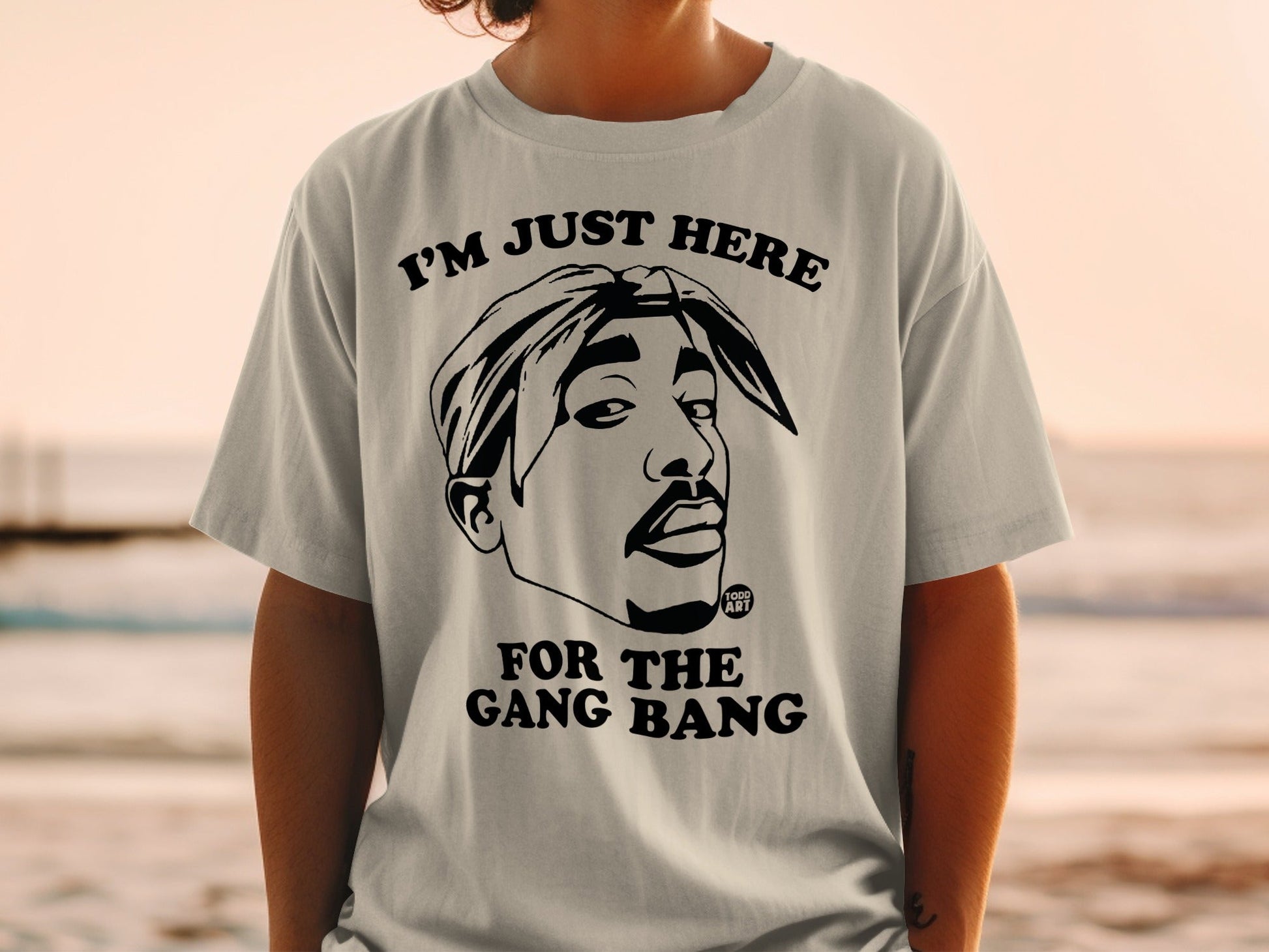 T-shirt featuring Tupac Shakur graphic and "I'M JUST HERE FOR THE GANG BANG" text.