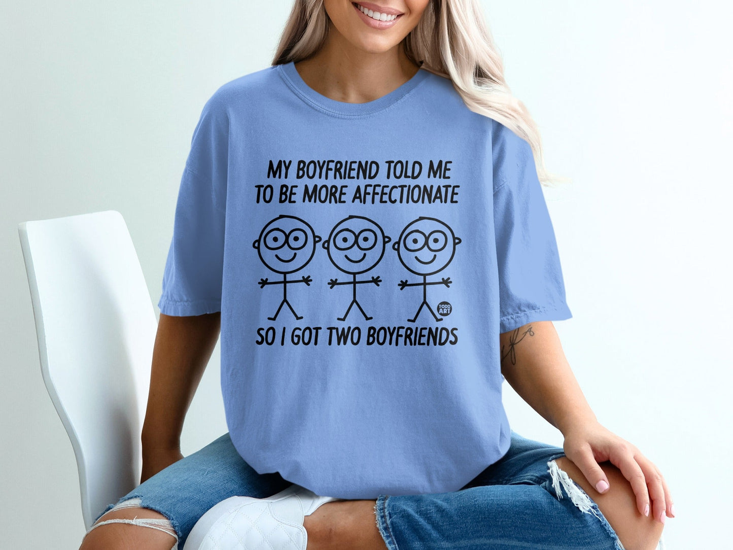 Light blue t-shirt with stick figures and text "My boyfriend told me to be more affectionate so I got two boyfriends".