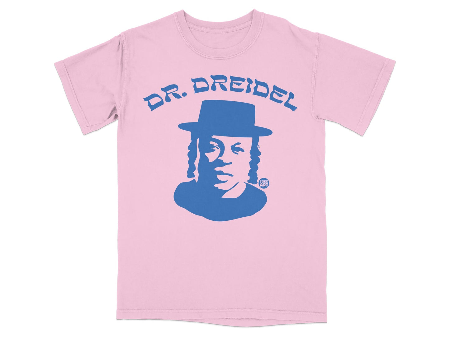 Pink t-shirt with a blue graphic of a man wearing a hat and the text "DR. DREIDEL" and "GOOD ART".