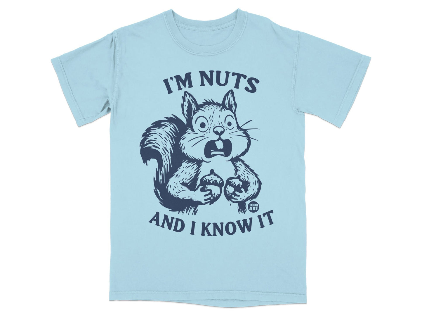 Light blue t-shirt with a startled squirrel holding acorns and text "I'M NUTS AND I KNOW IT".