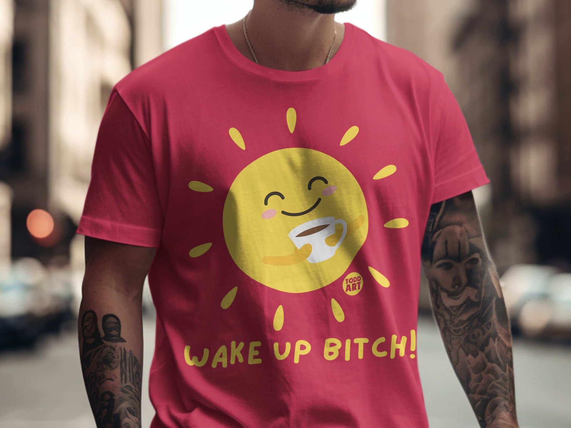 Red t-shirt with a smiling sun holding a coffee cup and text "WAKE UP BITCH!".