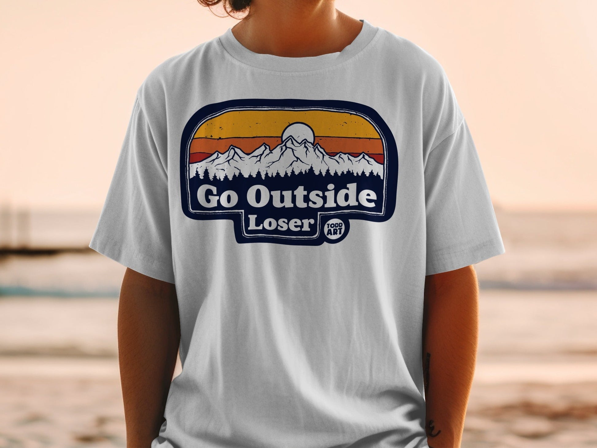 Go Outside Loser graphic t-shirt with mountains and sunset design.
