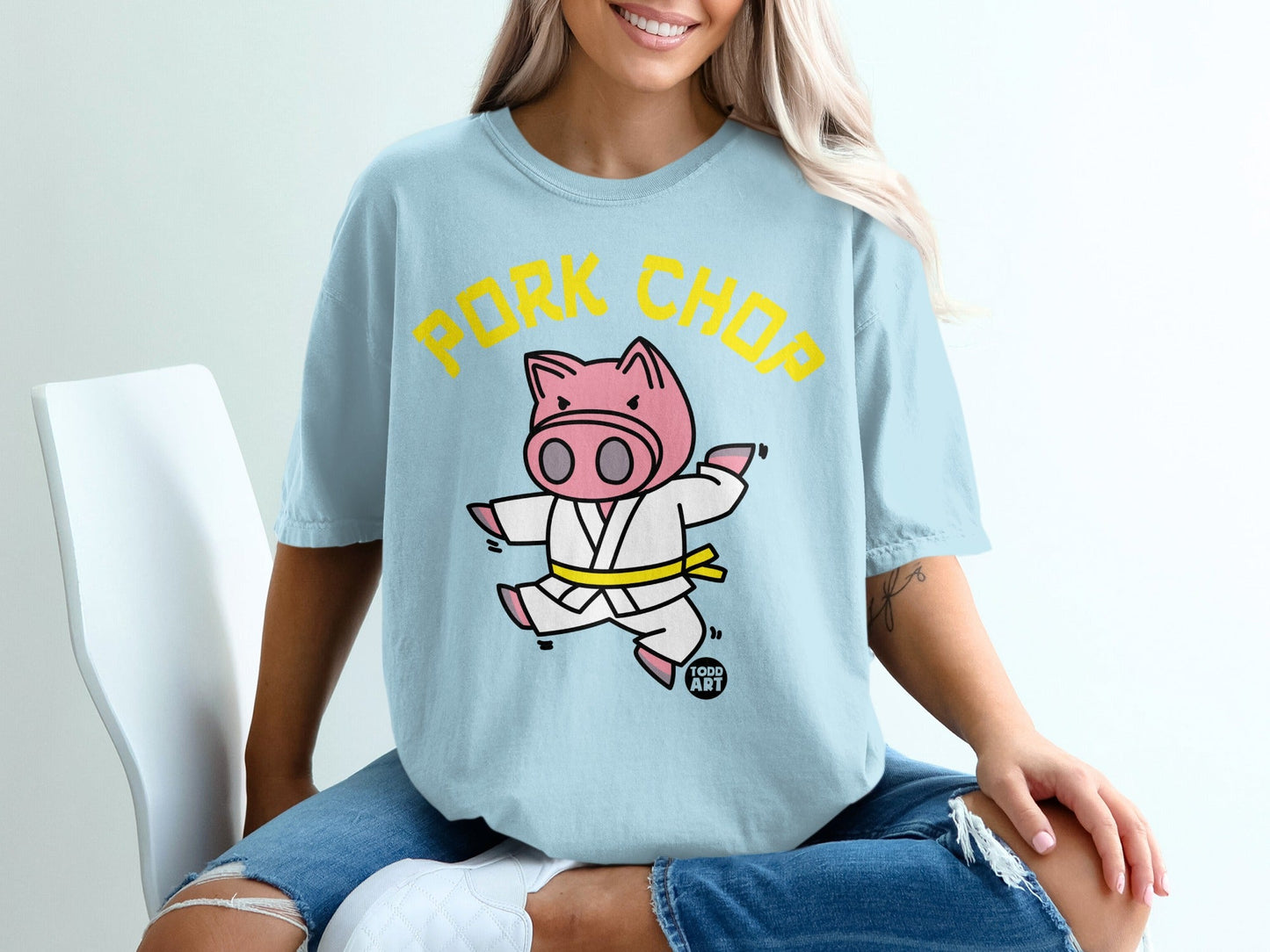 Cartoon pig in a karate gi with "Pork Chop" text.
