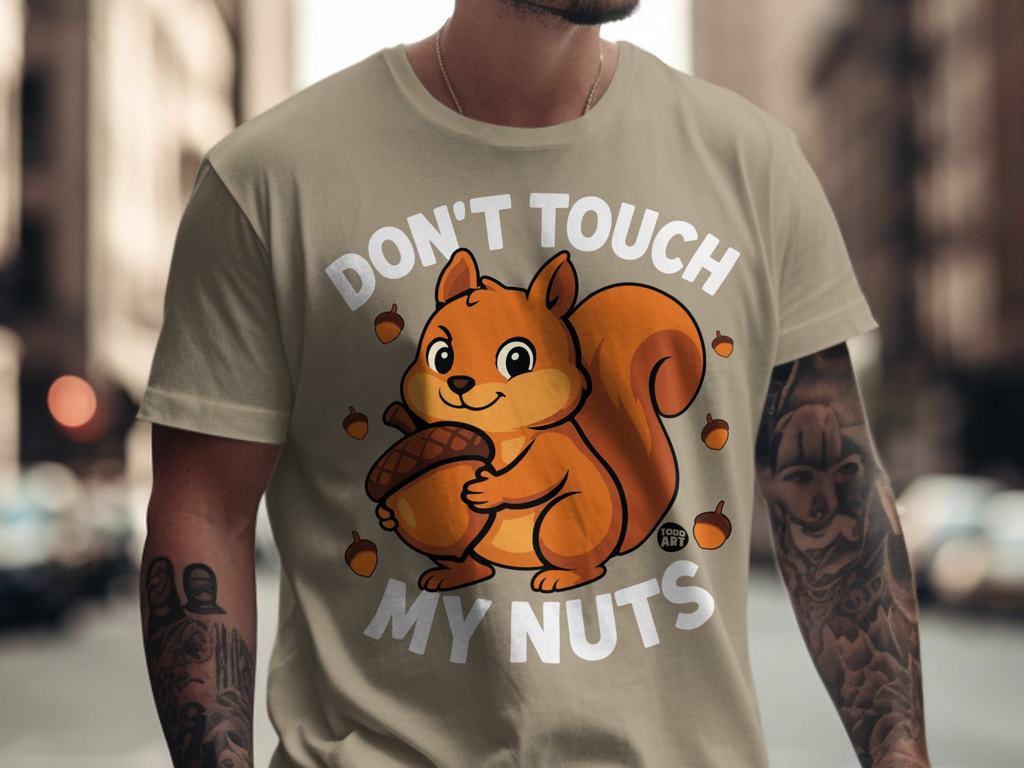 T-shirt with "Don't Touch My Nuts" and a squirrel holding an acorn.