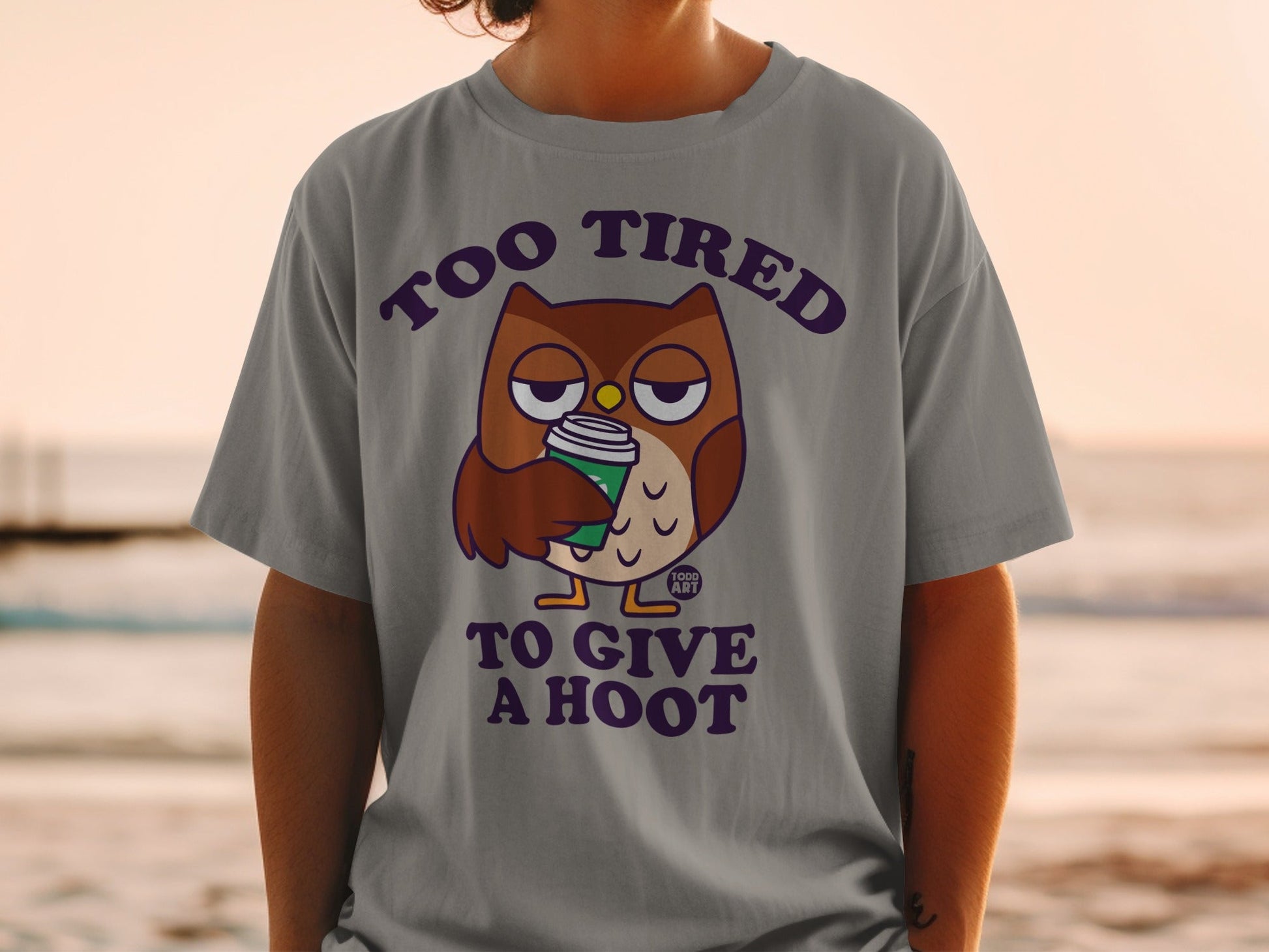 T-shirt with tired owl holding coffee and text "Too Tired to Give a Hoot".