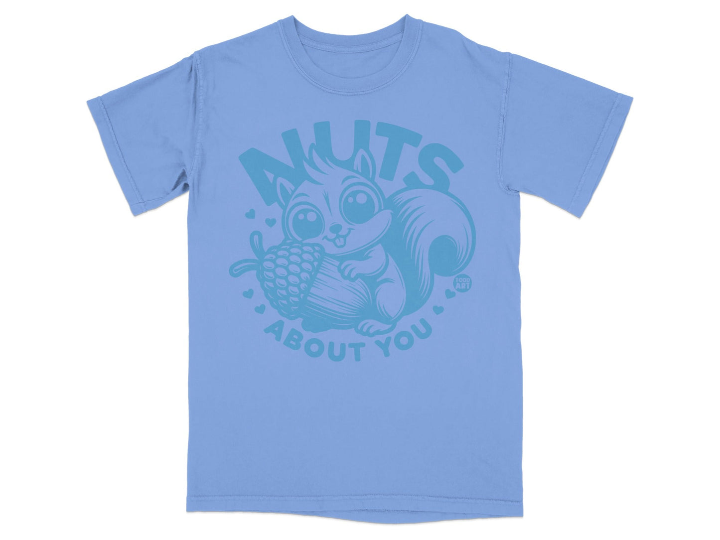 Blue t-shirt with cartoon squirrel holding an acorn, text reads "Nuts About You".