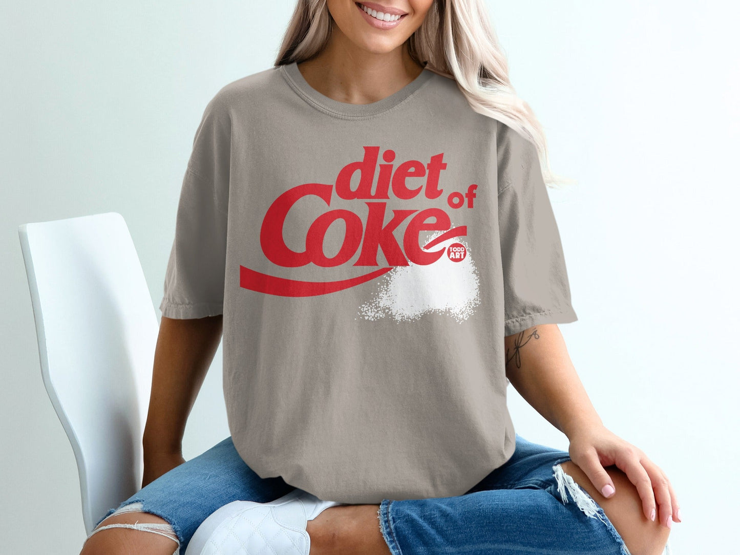 Diet Coke t-shirt with a powder-like substance and logo.