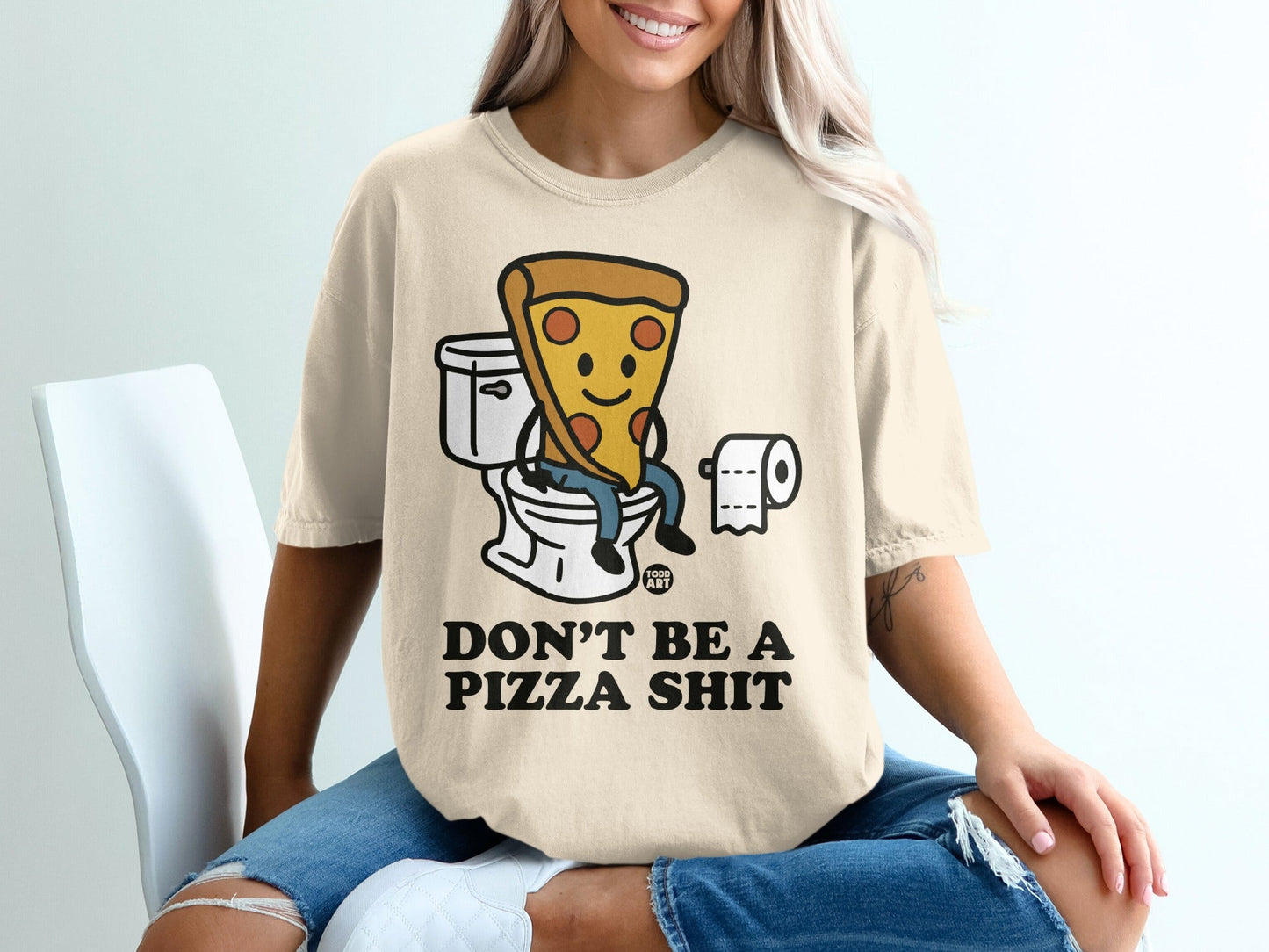 T-shirt with cartoon pizza slice sitting on toilet, text reads DON'T BE A PIZZA SHIT.