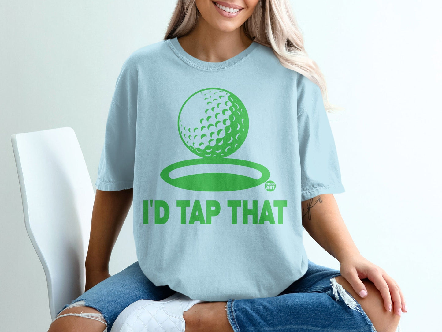Light blue t-shirt with green golf ball and "I'D TAP THAT" text.