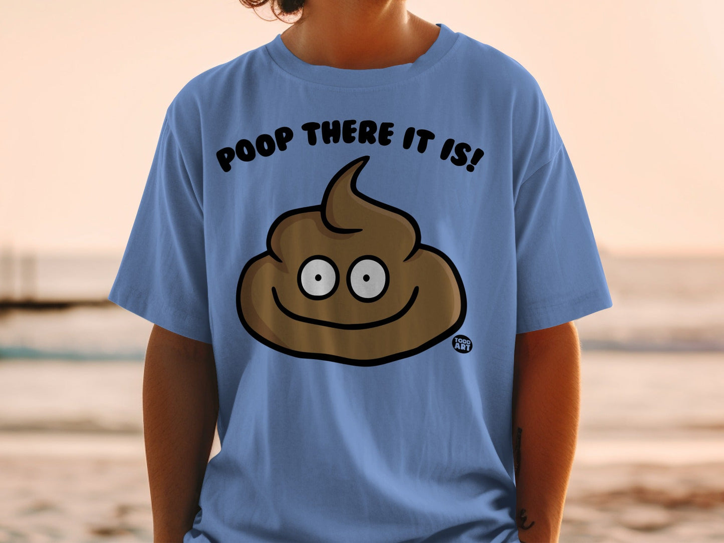 Blue t-shirt with a cartoon poop emoji that says "POOP THERE IT IS!".