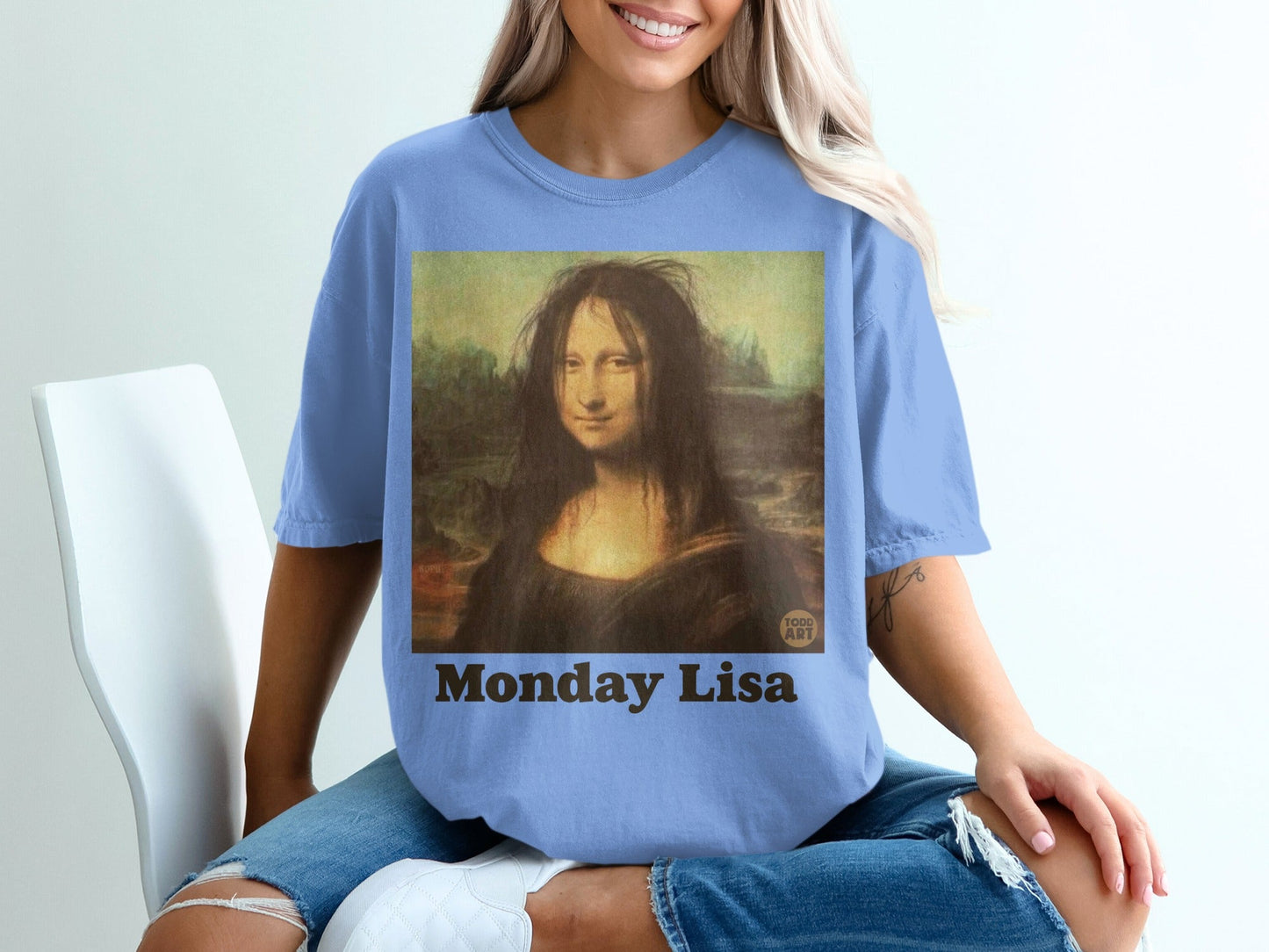 T-shirt featuring Mona Lisa with messy hair and "Monday Lisa" text.