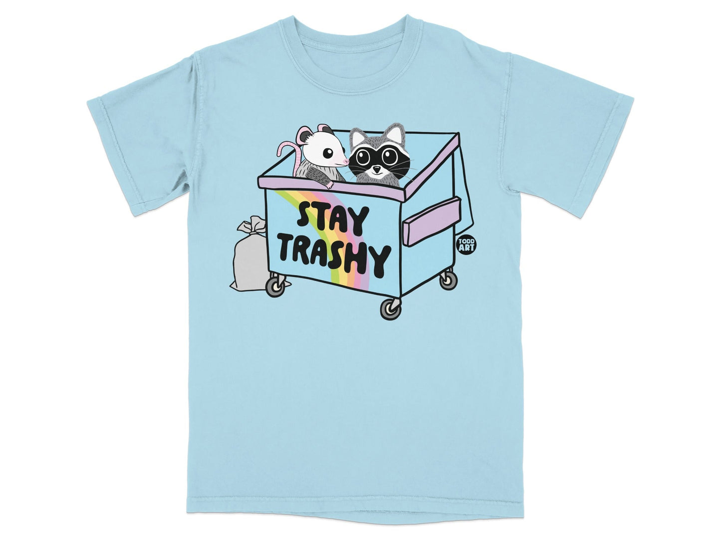 Light blue t-shirt with dumpster illustration featuring raccoons and mouse, text "STAY TRASHY".