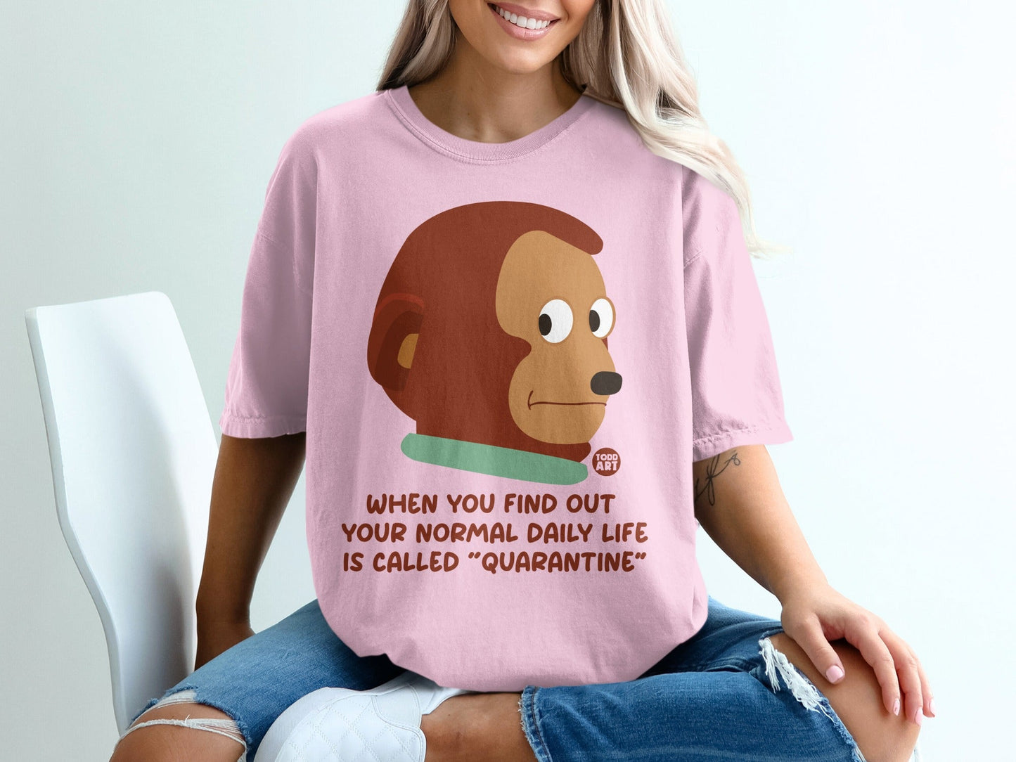 Pink t-shirt with cartoon monkey and "Quarantine" text.