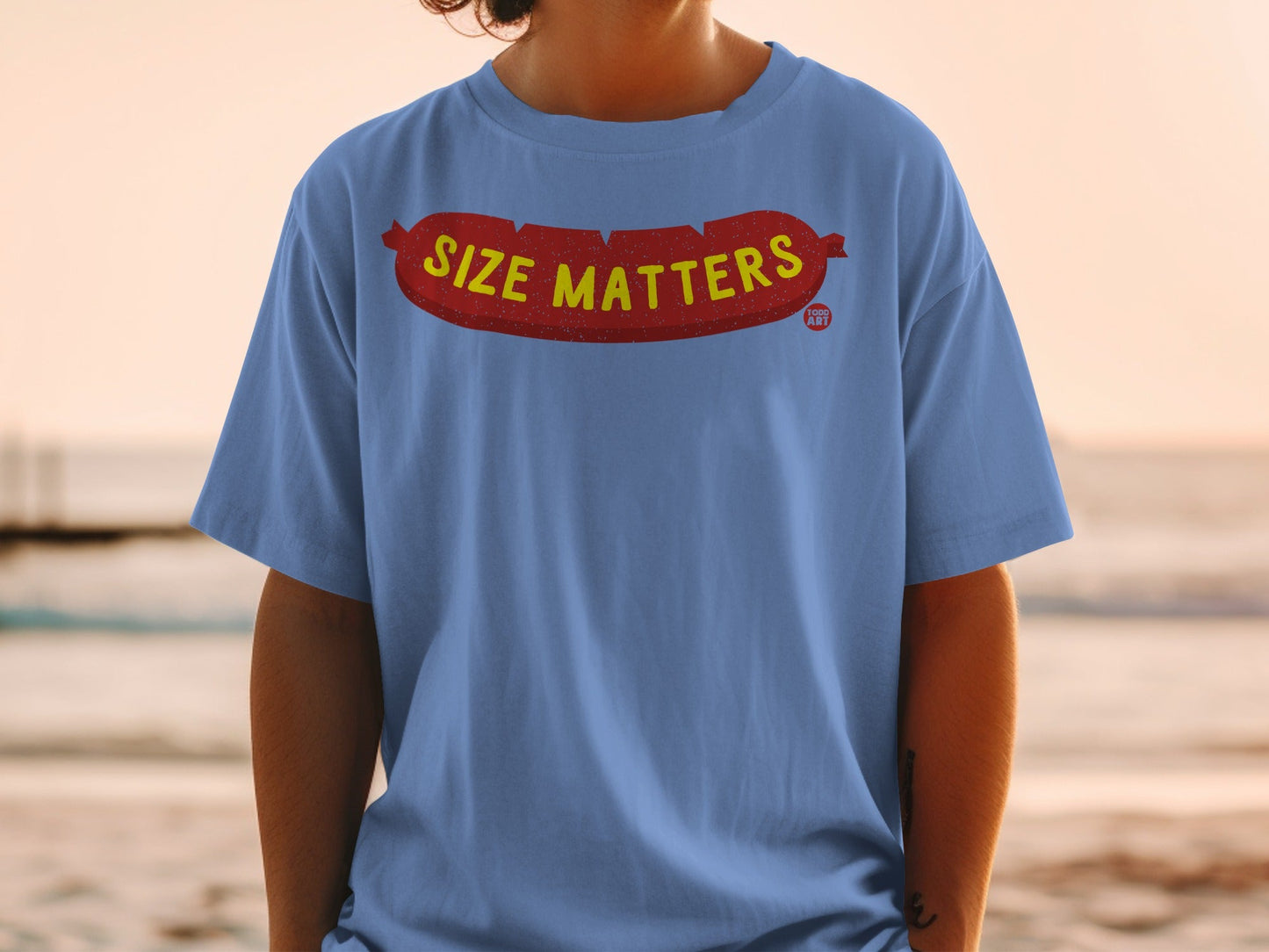 Blue t-shirt with "SIZE MATTERS" text on a cartoon sausage graphic.