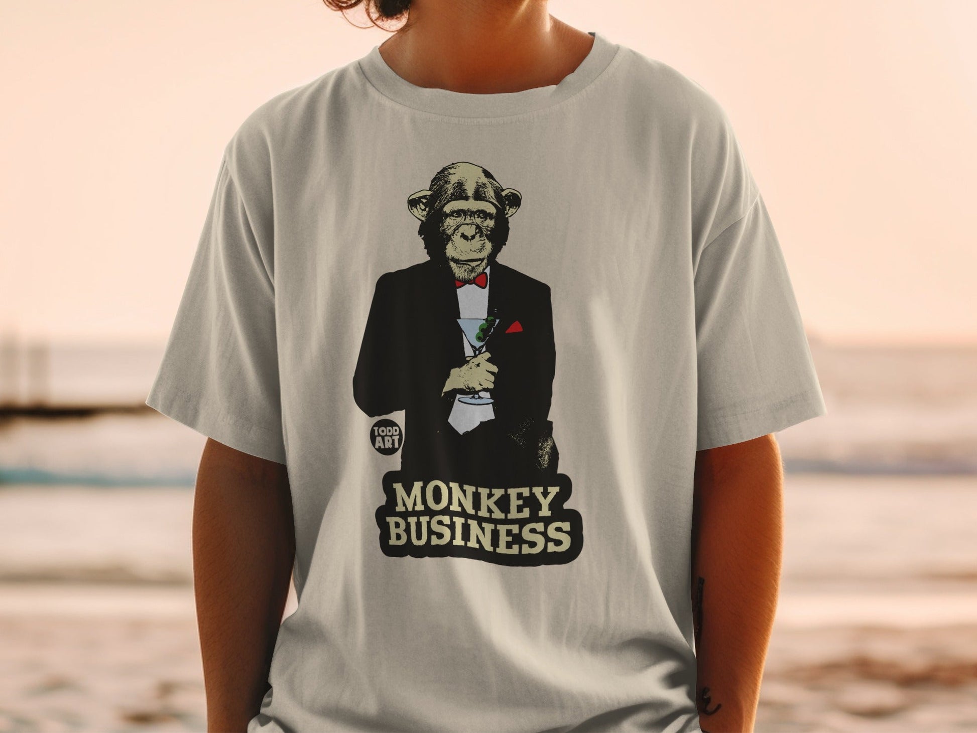 Monkey in a tuxedo holding a martini, "Monkey Business" text.