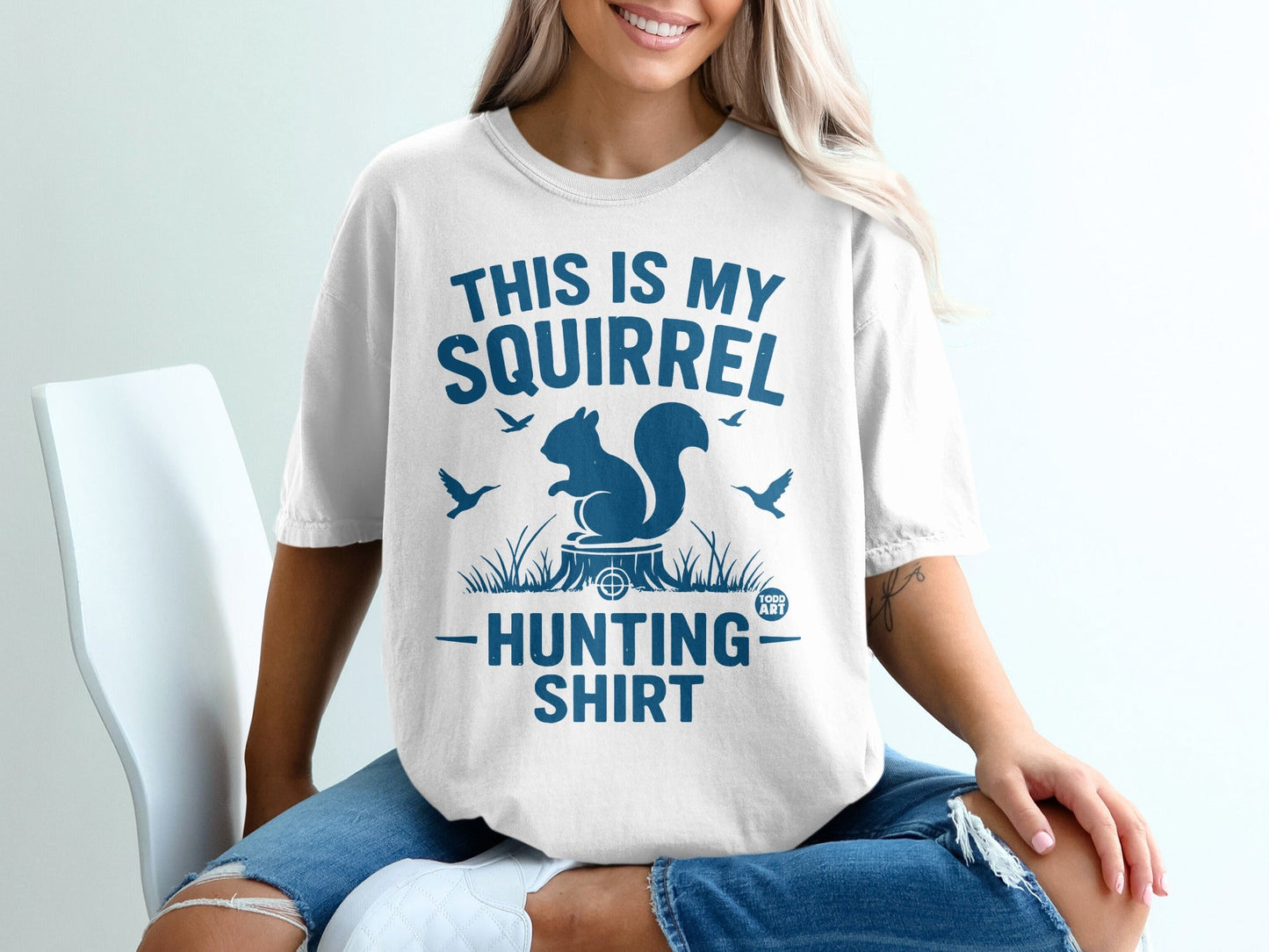 White t-shirt with "This is my squirrel hunting shirt" text and squirrel graphic.