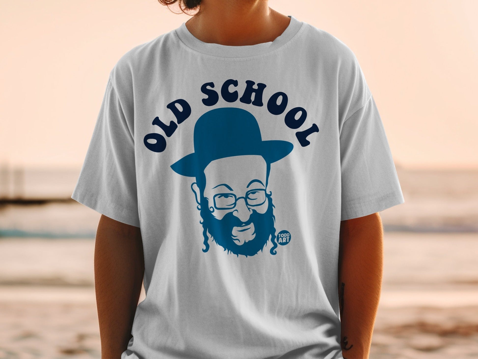 White t-shirt with a blue graphic of a man in a hat and beard, labeled "OLD SCHOOL".