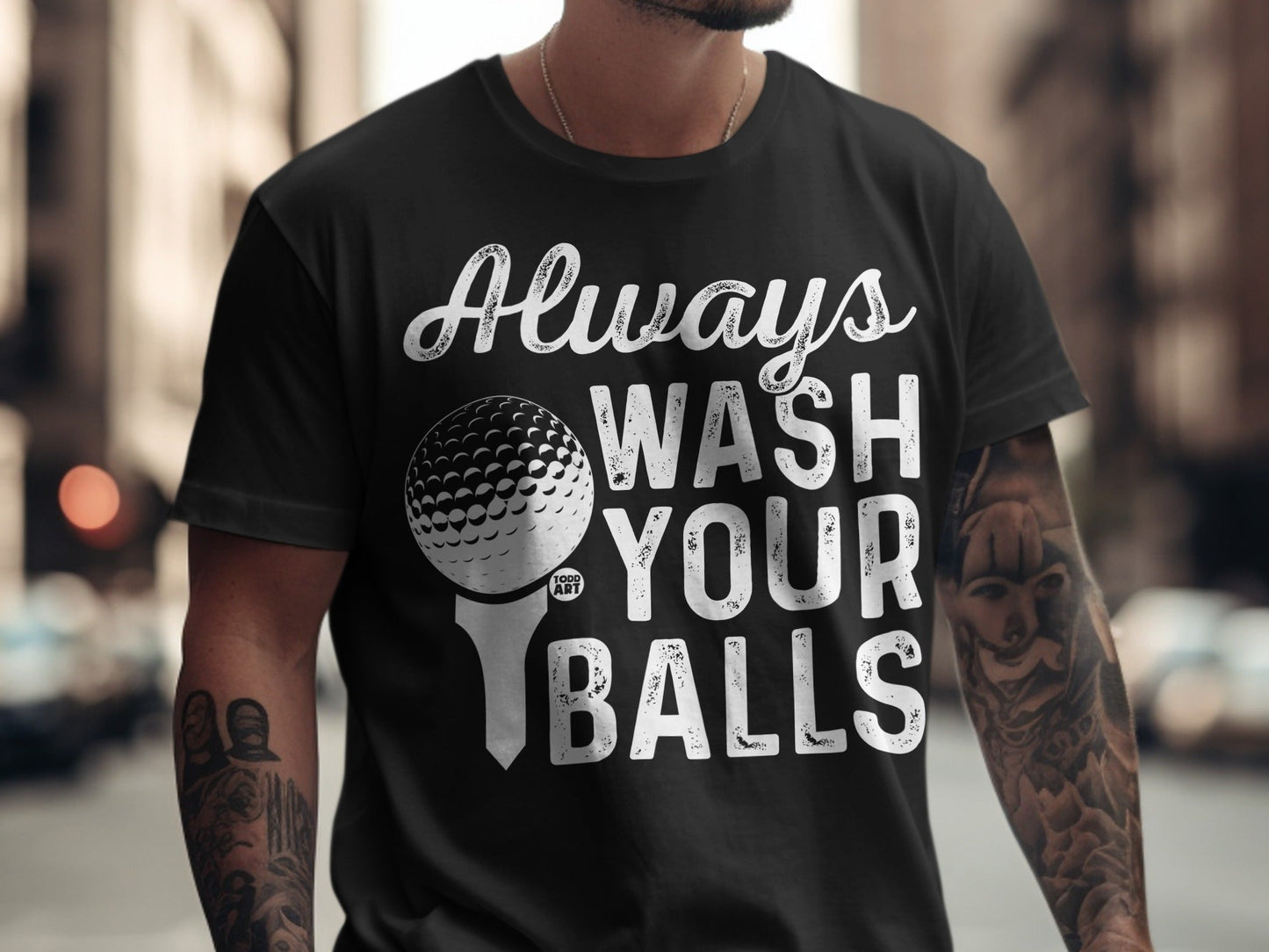 Black t-shirt with "Always Wash Your Balls" text and a golf ball graphic.