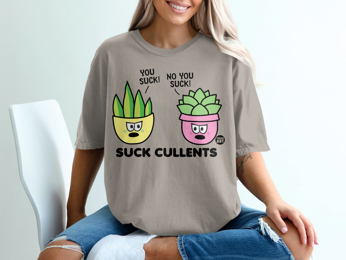 T-shirt with cartoon succulents saying "YOU SUCK! NO YOU SUCK!"