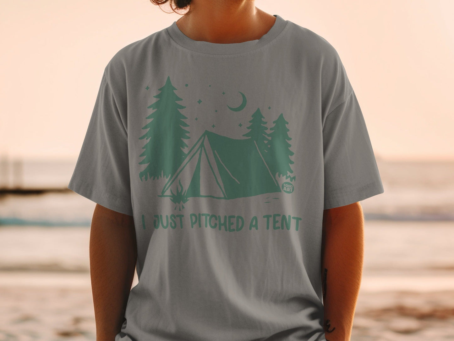 T-shirt with tent, trees, moon, and "I JUST PITCHED A TENT" text.