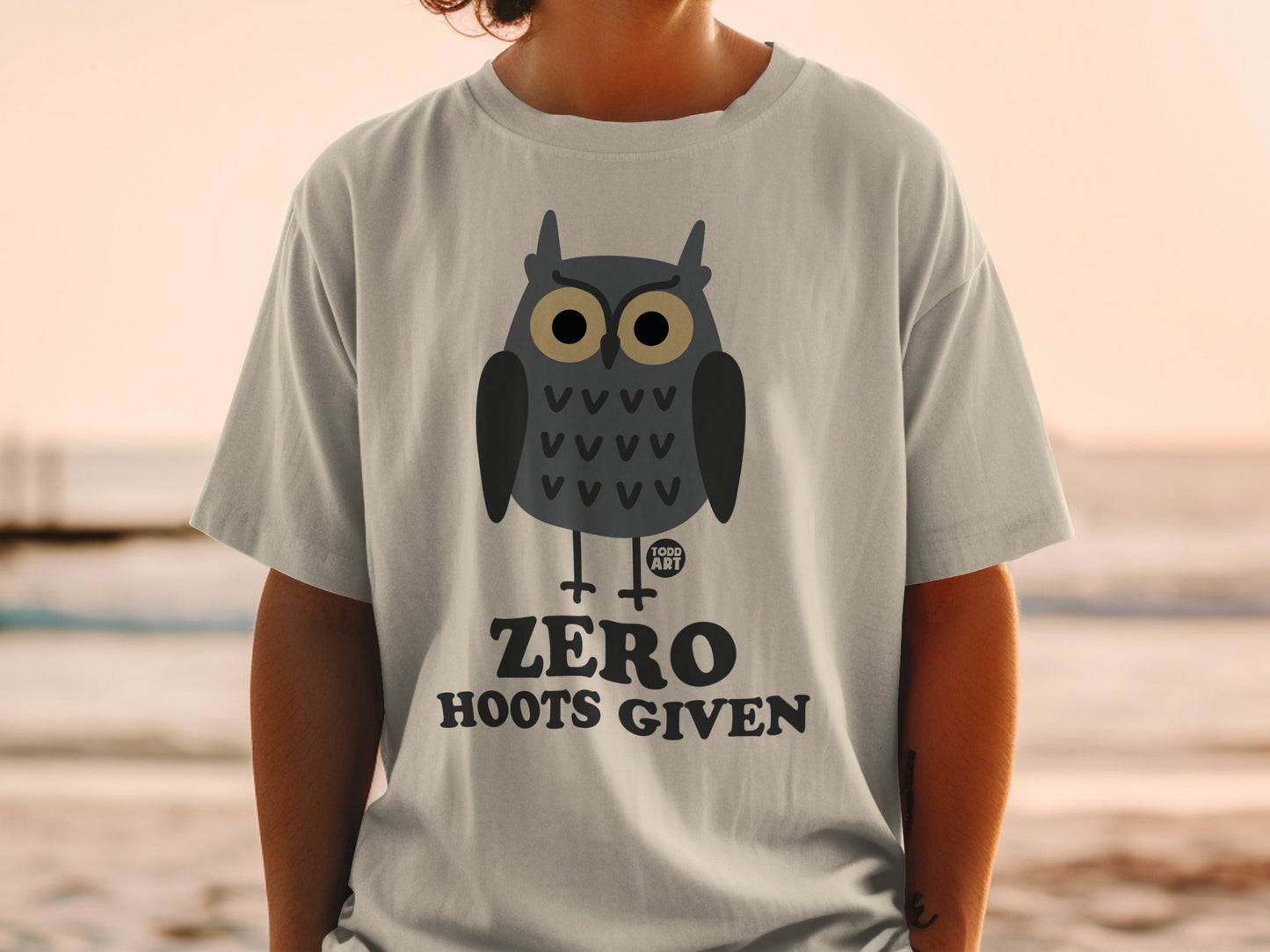 Gray t-shirt with a cartoon owl graphic and "ZERO HOOTS GIVEN" text.