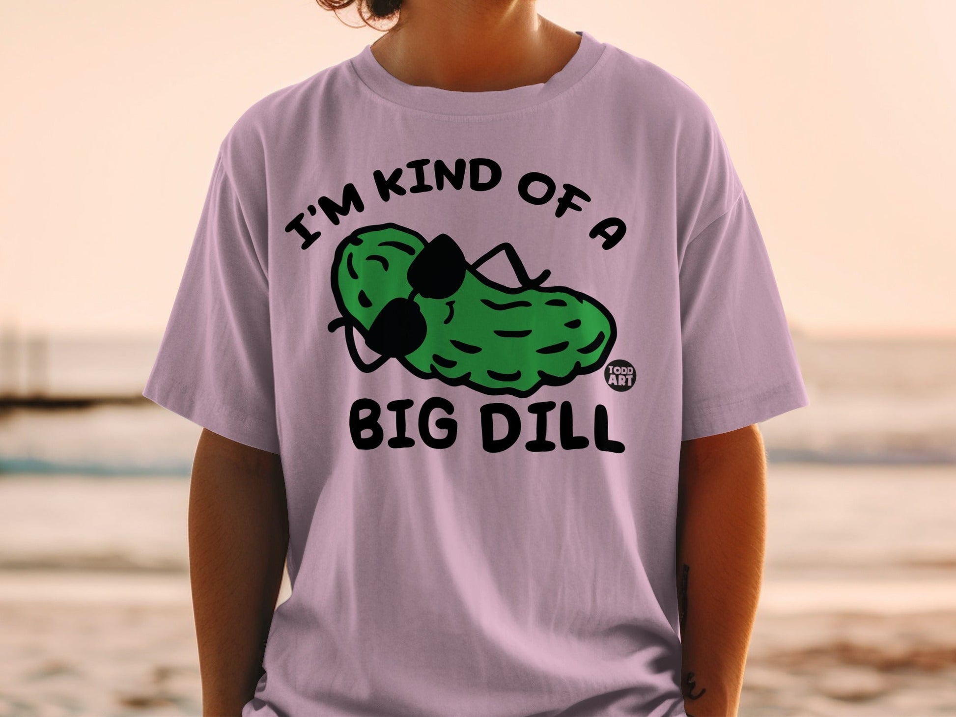 T-shirt with a cartoon pickle wearing sunglasses and text "I'm kind of a big dill".