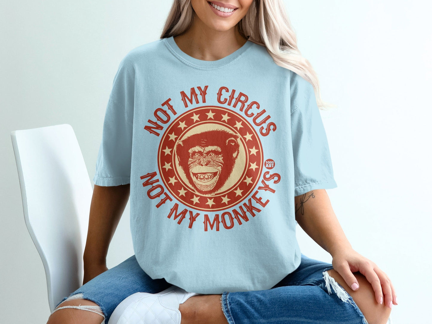 Light blue t-shirt with "NOT MY CIRCUS NOT MY MONKEYS" text and monkey graphic.