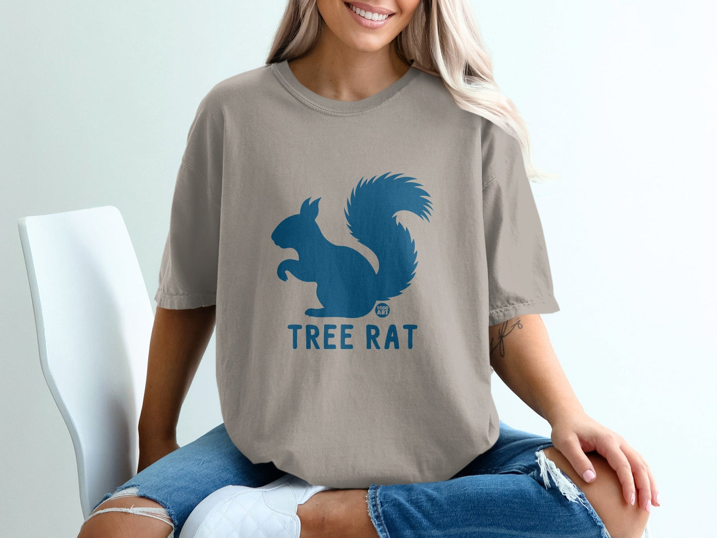 T-shirt with blue squirrel graphic and "TREE RAT" text.