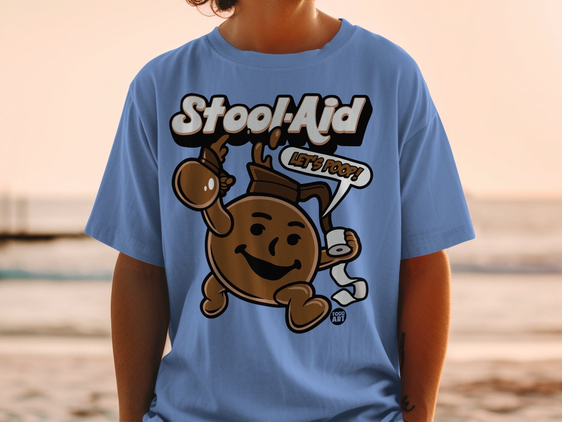 Blue t-shirt with "Stool-Aid" text and cartoon character holding toilet paper.