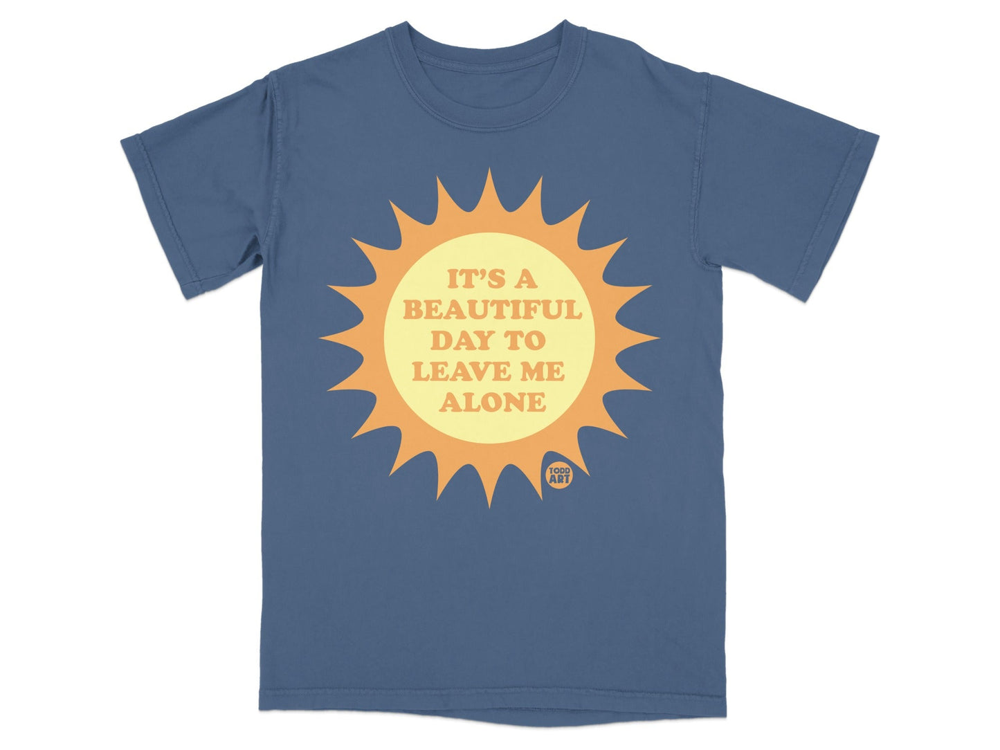 Blue t-shirt with a sun graphic and text reading "IT'S A BEAUTIFUL DAY TO LEAVE ME ALONE".