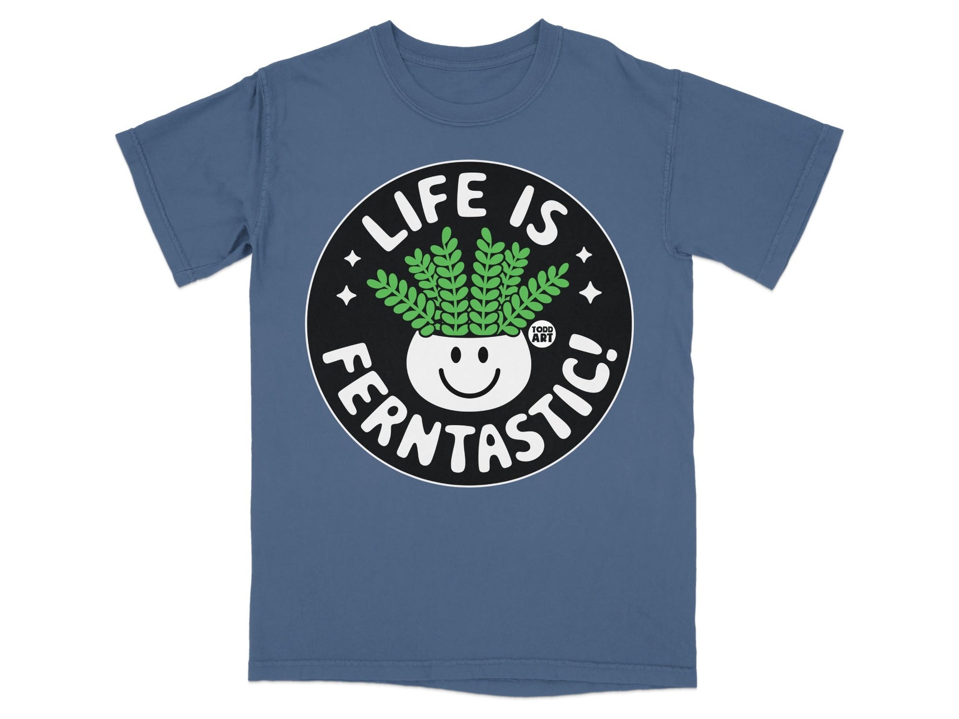 Blue t-shirt with a circular graphic featuring a smiling plant in a pot and text "LIFE IS FERNTASITC!".
