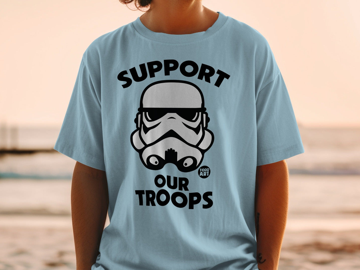 Light blue t-shirt with "SUPPORT OUR TROOPS" and Stormtrooper helmet graphic.