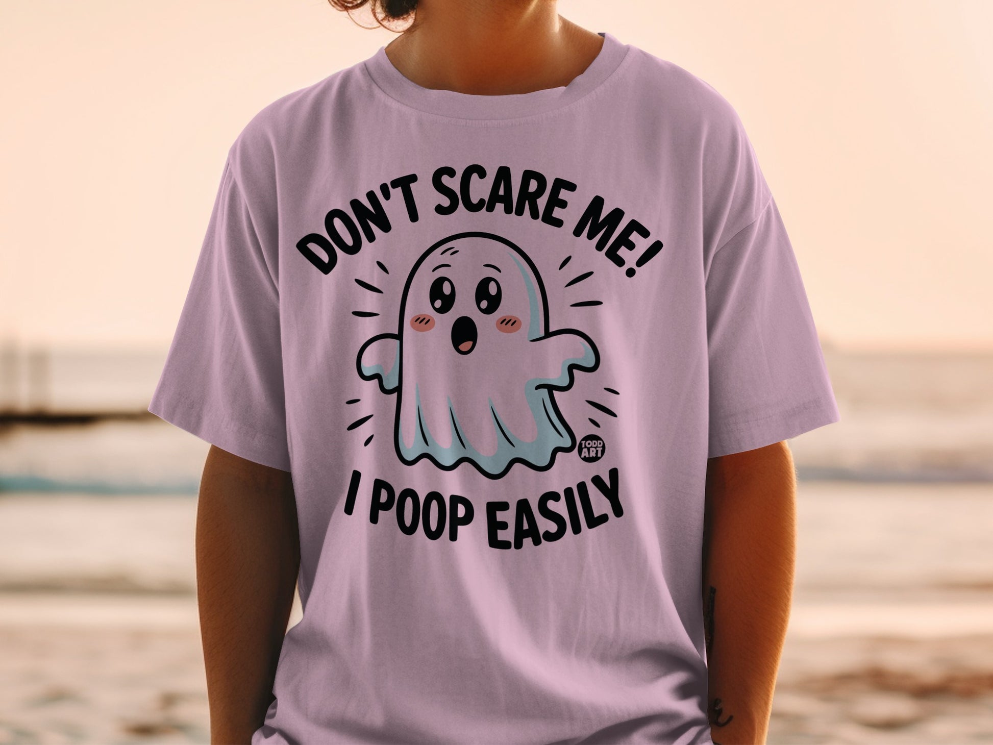 Purple t-shirt with a ghost graphic and text "Don't scare me! I poop easily."