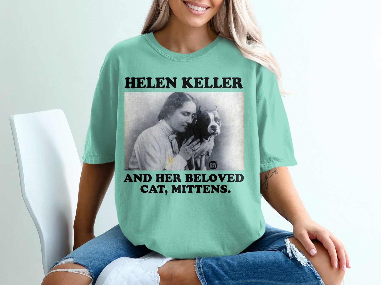 Helen Keller and her cat Mittens graphic t-shirt.