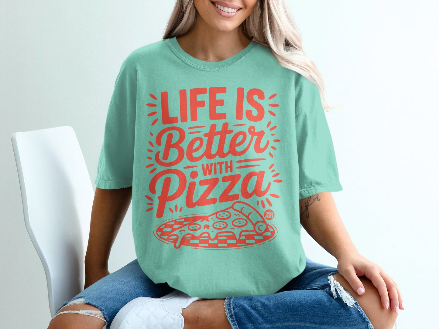 Mint green t-shirt with "Life is Better with Pizza" and pizza graphic.