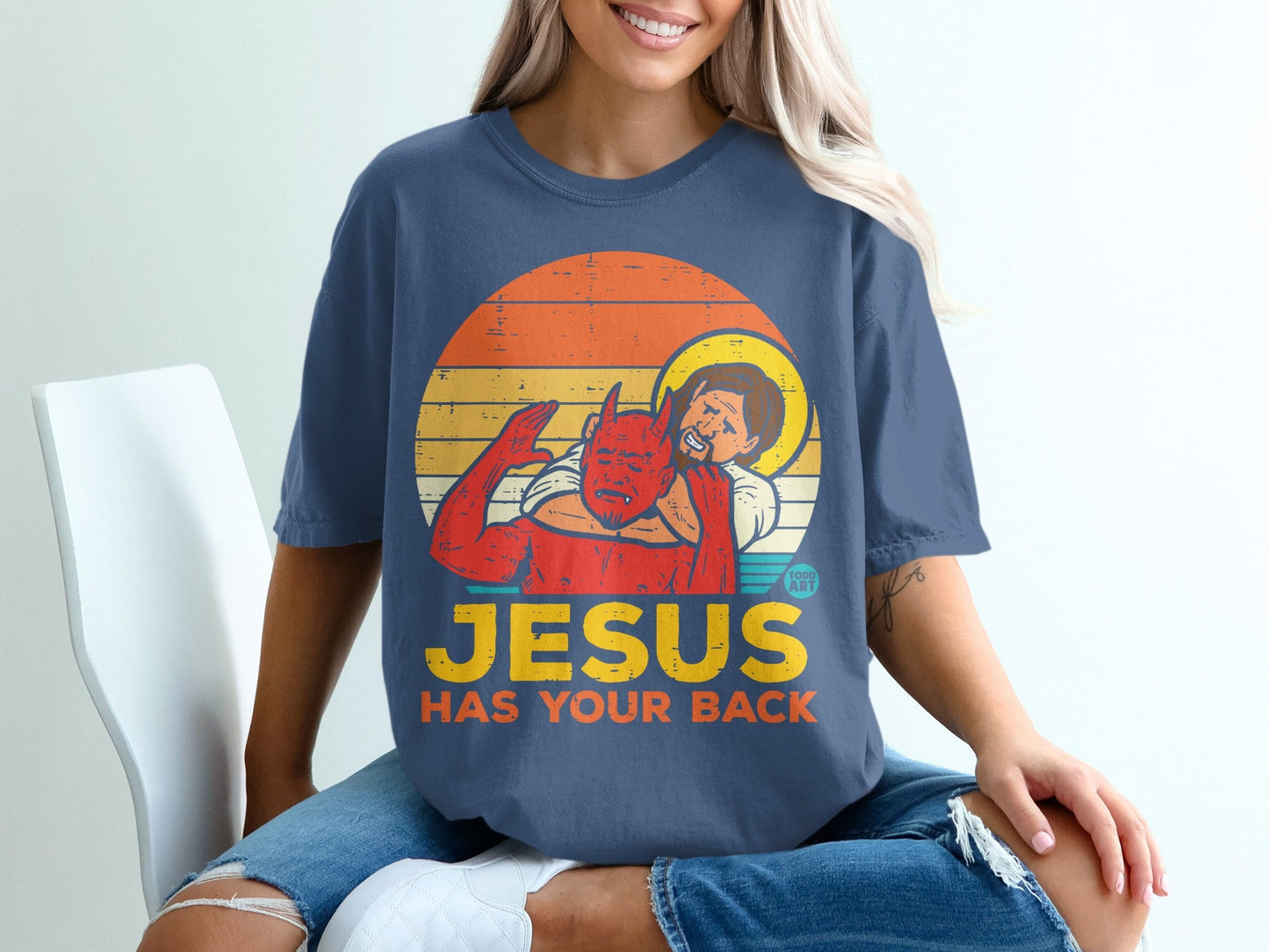 Graphic of Jesus hugging a devil with "JESUS HAS YOUR BACK" text.