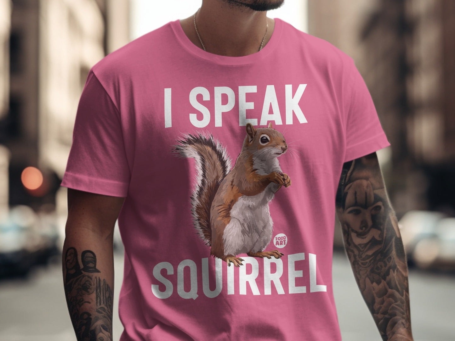 Pink t-shirt with "I SPEAK SQUIRREL" and a squirrel illustration.