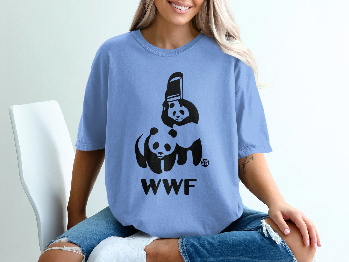Blue t-shirt with black WWF logo featuring two pandas and a trash can.